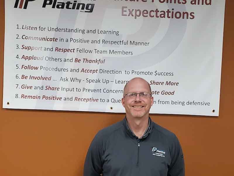 man standing in front of sign