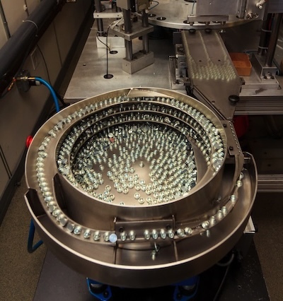 Parts are sorted and counted by Graystone before being shipped to customers, another automation machine designed by company engineers.