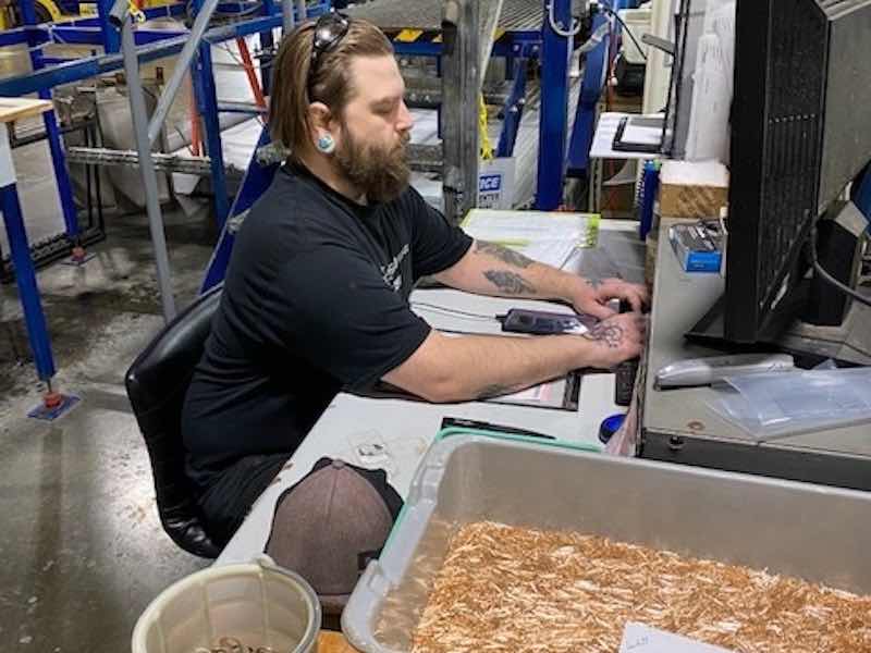 man working with small parts