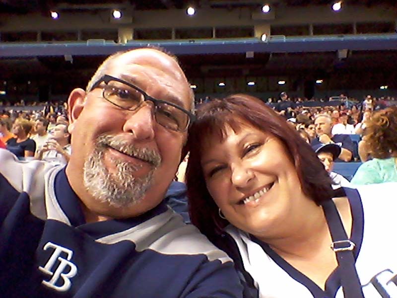 man and woman at baseball game