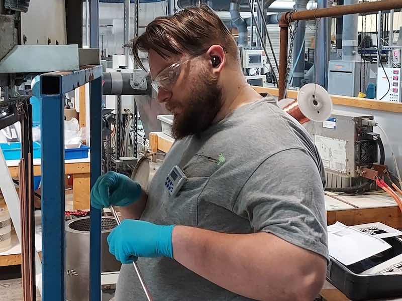 man working on a plating line
