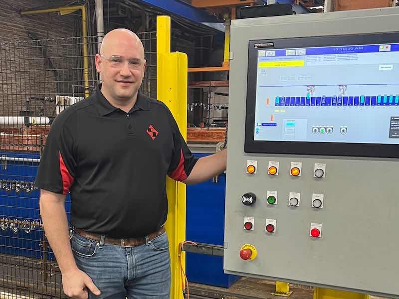 Steve stone standing at machinery