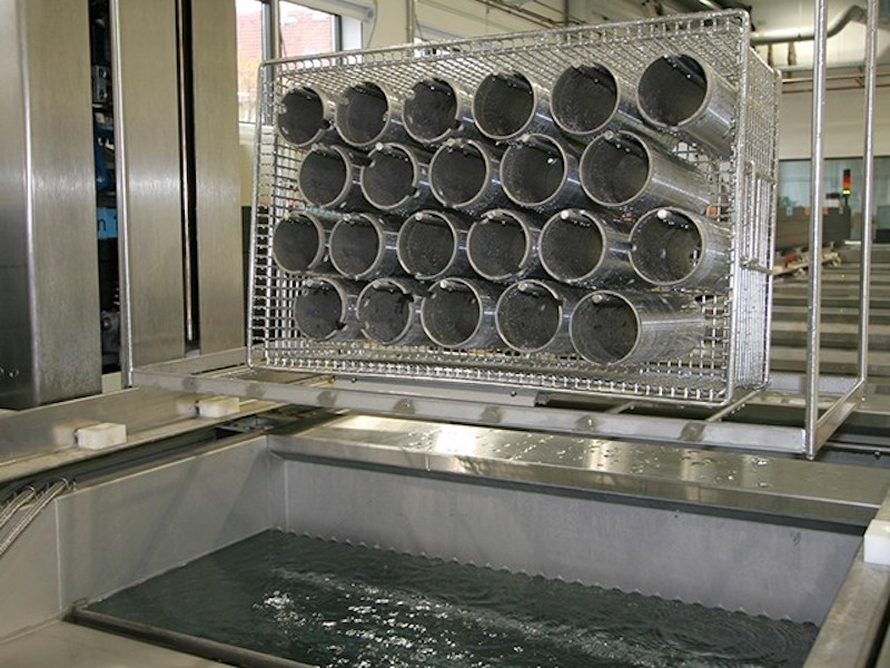 parts being cleaned in tanks