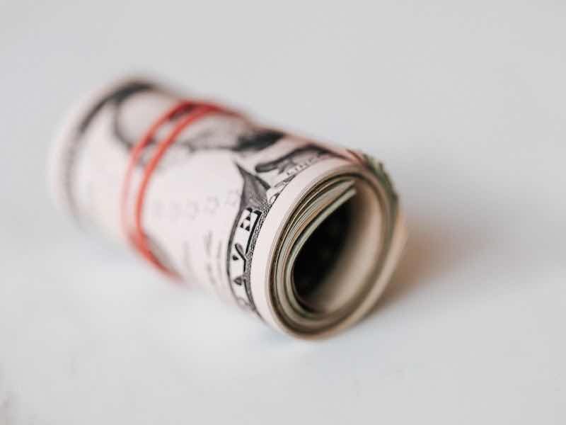 money in a wad with a rubberband