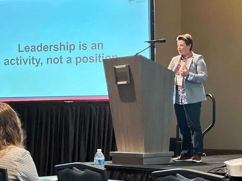 woman speaking at conference