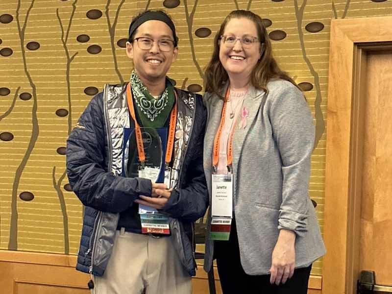 The Genny Dwyer Volunteer of the Year Award was presented to Dr. George Oh, Senior Research and Development Chemist in the Metal Finishing Division of Quaker Houghton. AAC Chair Janette Courtney of Bonnell Aluminum presented the award. 