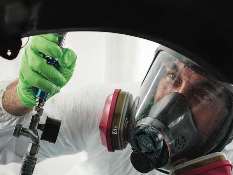 man painting parts