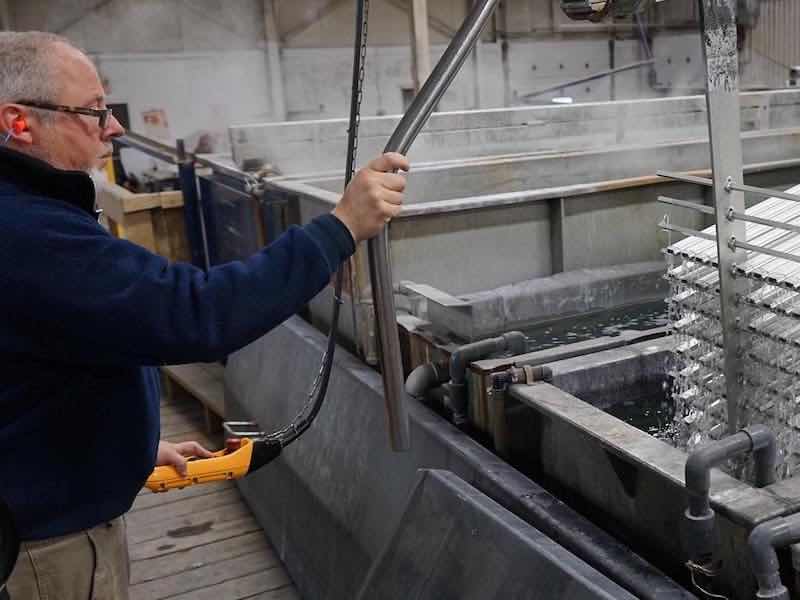 man anodizing parts