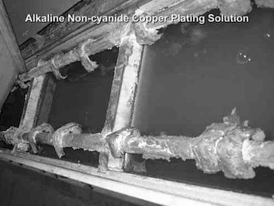 Photo 6: Tank with copper plating solution showing limited free- board and accumulated salts.