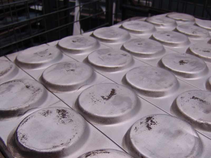 "Chicken cracks" caused by excessive grinding pressure and/or insufficient lubrication.