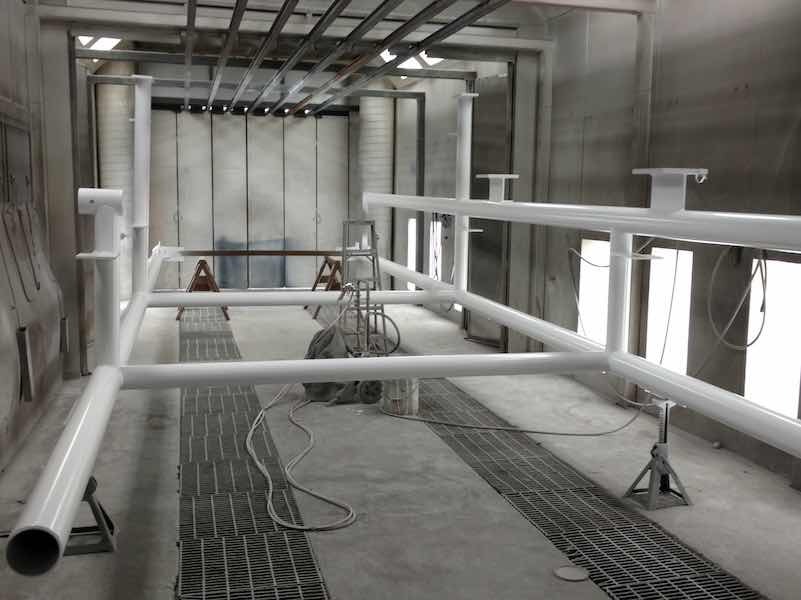 Anchor Bay Powder Coat has a 1,000-foot automatic line with a booth size of 20 feet by 11 feet by 8 feet, with an oven size of 26 feet by 8 feet by 8 feet; they also have a second 1,000-foot line with a booth size of 28 feet by 16 feet by 12 feet with an oven size of 24 feet by 10 feet by 9 feet.