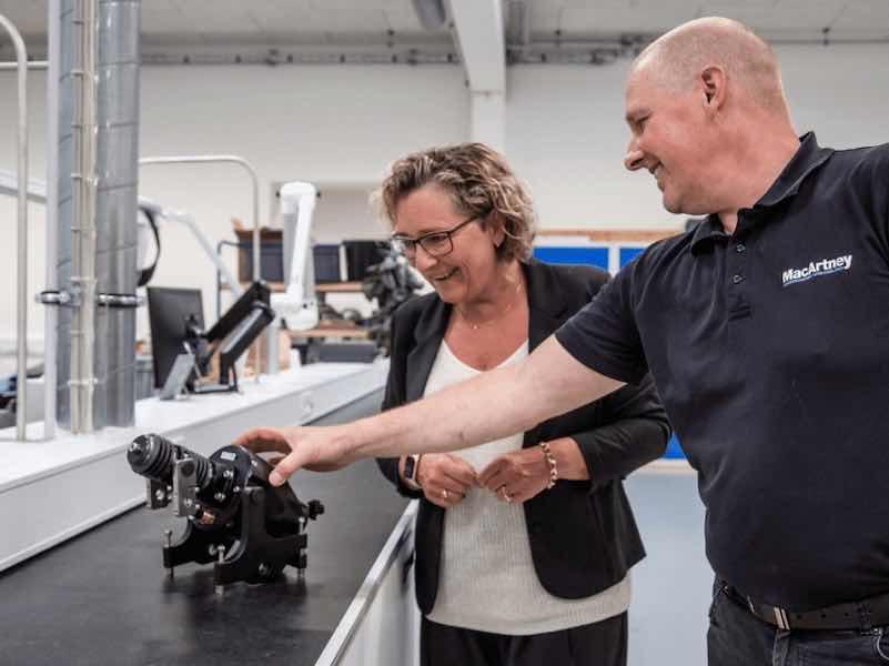 man and woman looking at parts
