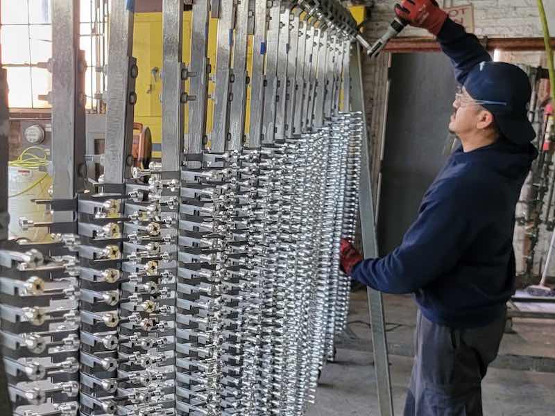 man racking parts