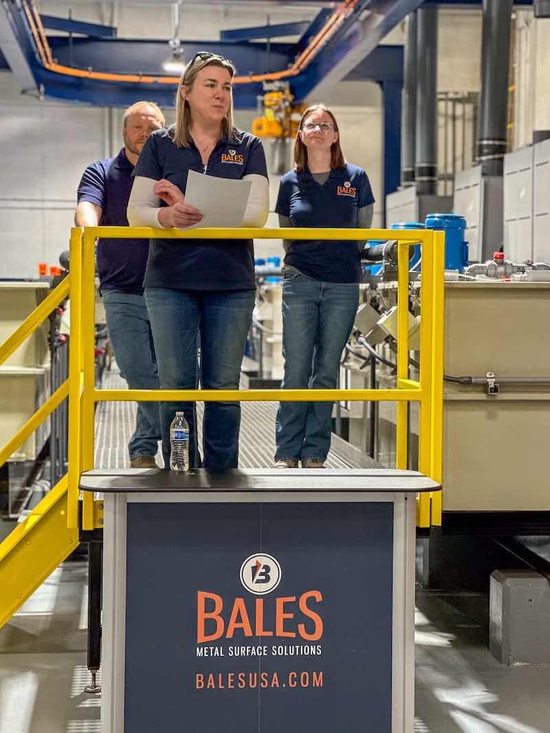 Owners Sara Mortensen and Stacey Bales, and Mike Hill, operations manager at Bales, dedicate their new lines.