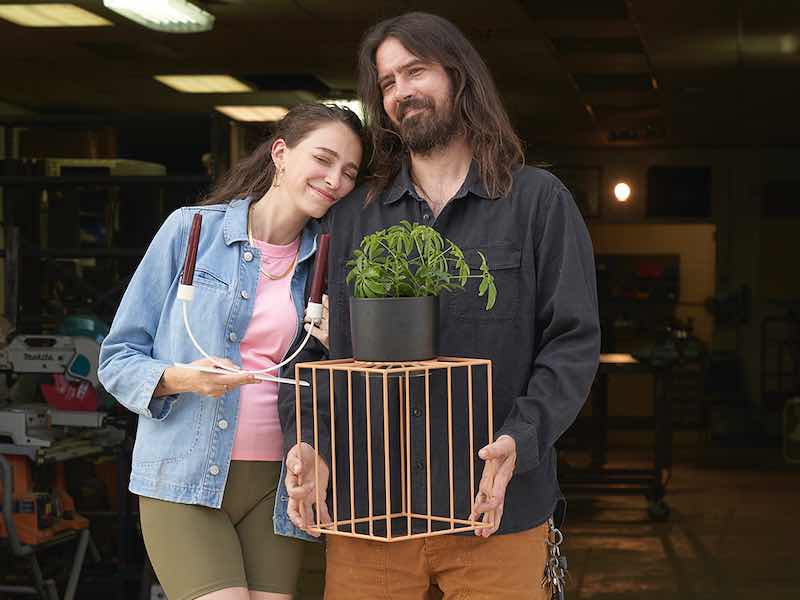 Jayna and Justin Roy standing in front of their shop