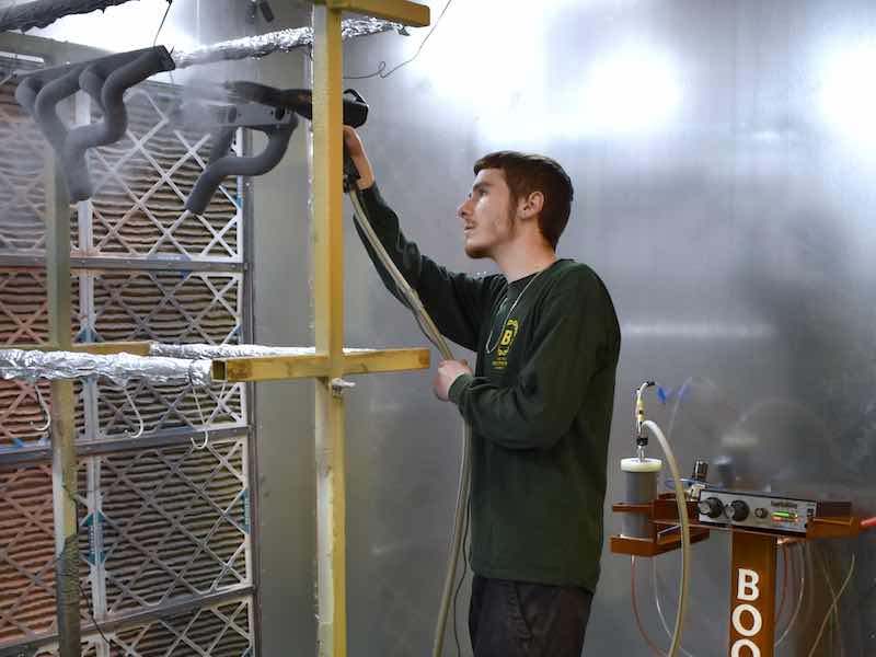 Pat Dunn powder coats customer parts at Boonies Design and Fabrication.
