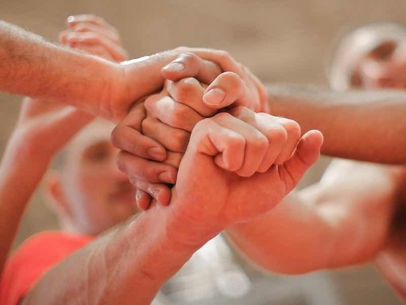 teams stacking hands