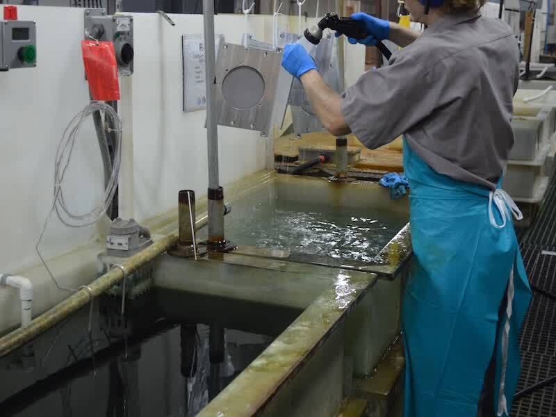 person working plating line