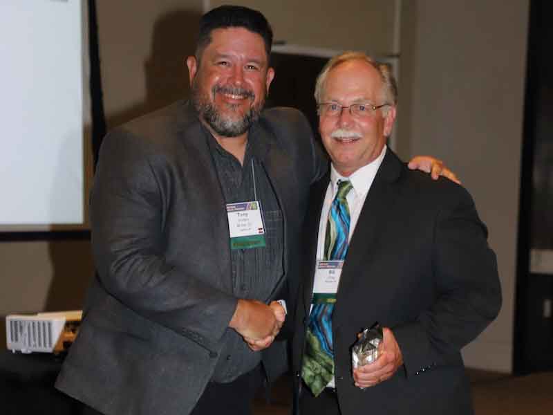 CCAI National President Tony Sclafani (left) presents the CCAI James F. & David J. Wright Lifetime Achievement Award to Bill Oney. 