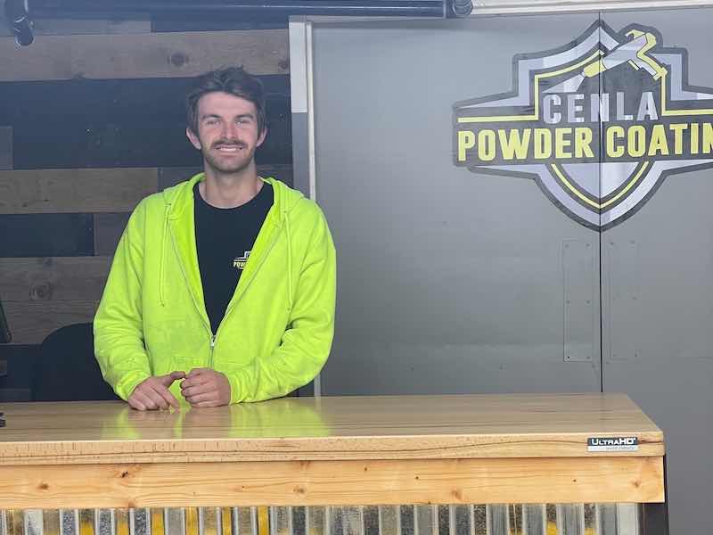 man standing in a powder coat shop