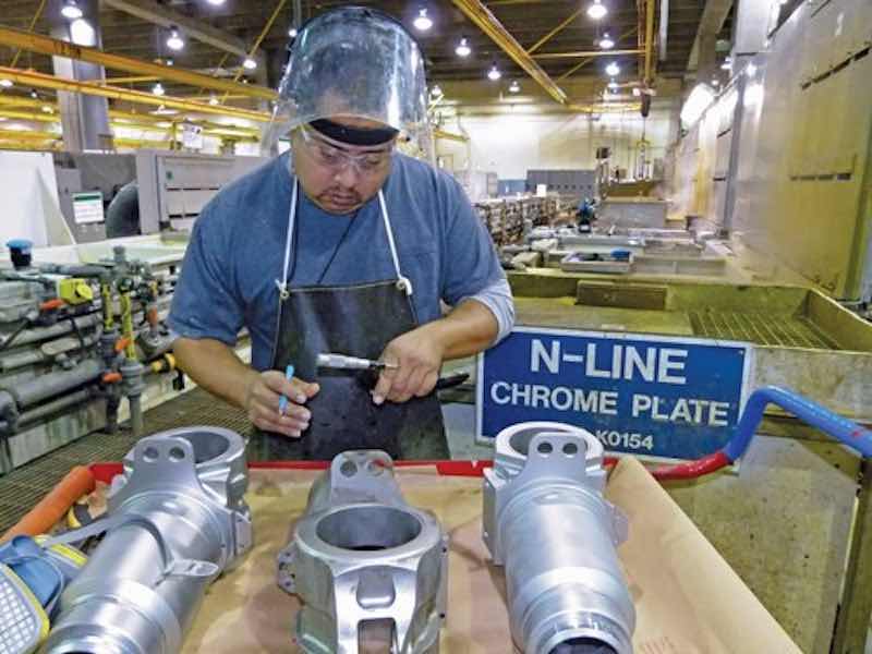 man working on parts