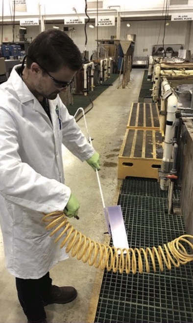 Peter Sheridan air drying an eTCP-coated panel at FRC Southeast. (Photo Credit: Sjon Westre)