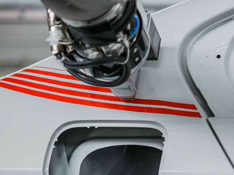 paint being applied to a car