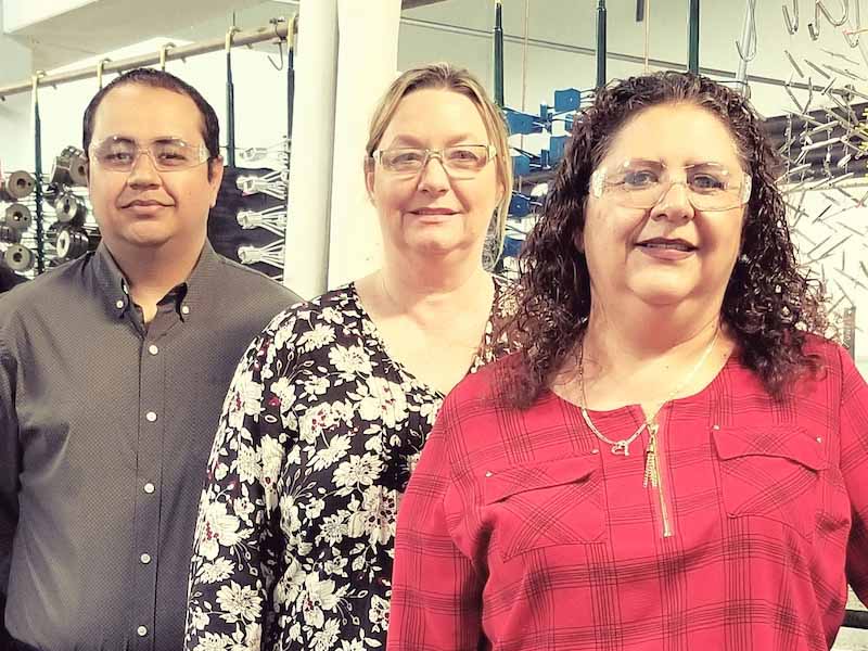 Frank Bautista, production manager; Suzan Russo, general manager; and Rose Bautista, customer service manager.