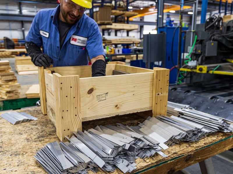 parts being unpacked by a worker
