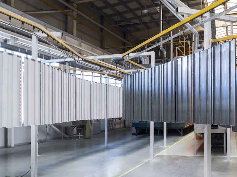 metal sheets being powder coated