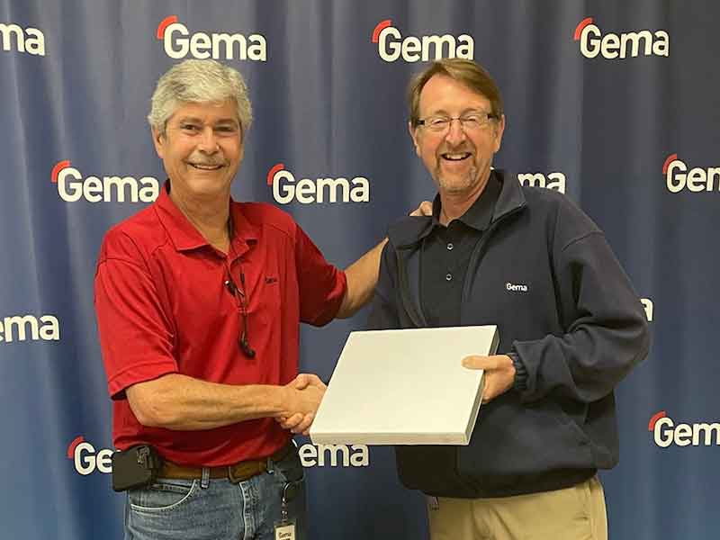 two people standing presenting award