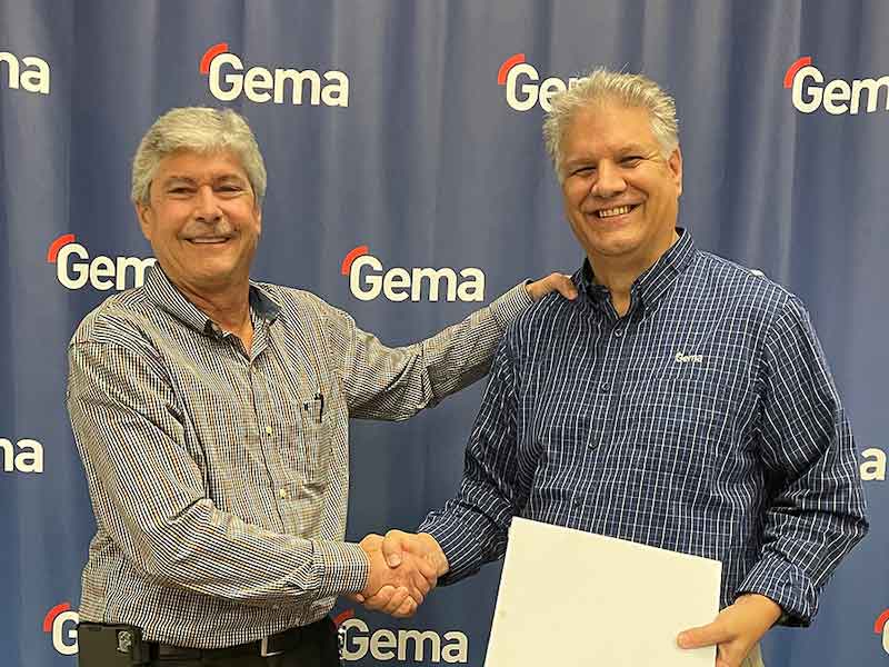 two man standing holding a plaque