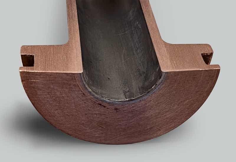 Cross section of a Hardide coated copper nozzle after 22hrs+ service with Stellite 6 Powder showing no pickup present.
