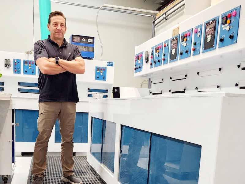 man standing in anodizing shop