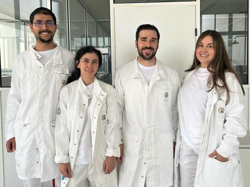 Spain members standing for photos