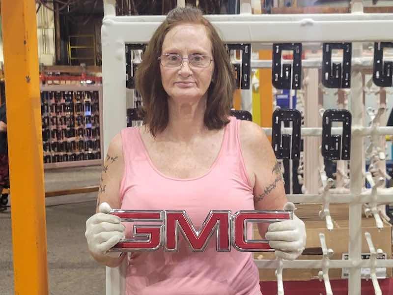 person holding GMC sign