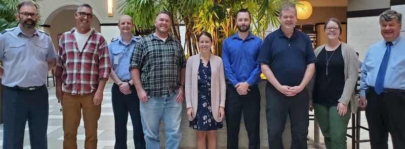 From left to right, Wing Commander Gareth Bean (United Kingdom Royal Air Force), Jason Lindt (USN), Sergeant Wayne âClintâ Eastwood (United Kingdom Royal Air Force), Eric Sievert (USN), Dr. Christin Duran (AFRL), Ben Thrasher (USAF), Scott Fetter and Megan Brooks (LM), and Rich McKinley (AFRL Contractor).