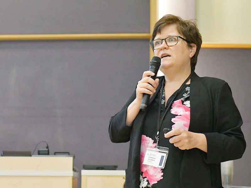 Catheen Crudden welcomes team members and guests to the Carbon to Metal Coating Institute launch event.