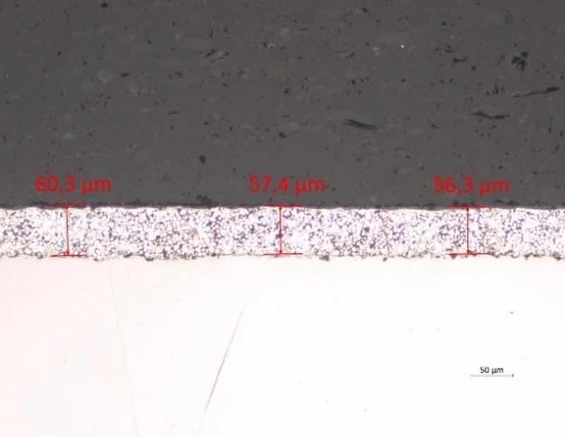 Figure 5 The microstructure of the sacrificial aluminum-ceramic coating from FIGURE 4 prepared by the MW Coatings Hub laboratory using less aggressive grinding and polishing parameters and after rotating the sample in the holder by 180Â°.