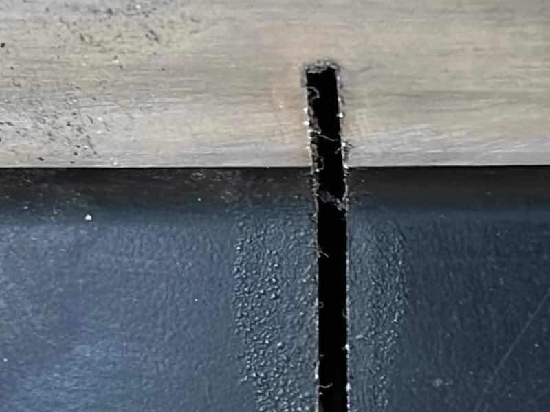 PTFE coating with a low coefficient of friction for continuous use up to 500Â°F (260Â°C) - damaged during cutting - burnt and dusty.