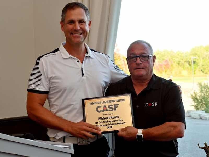 mike kuntz receiving award