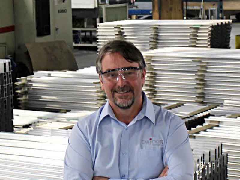 man standing in a shop floor