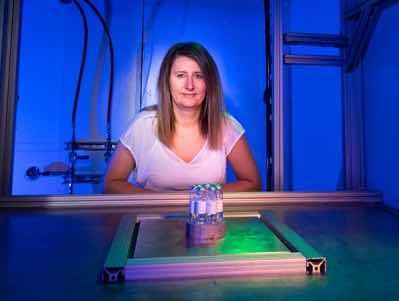 Slavica Grdanovska presents water sample containers ready for testing at the A2D2 electron beam accelerator at Fermilab. Photo: Ryan Postel, Fermilab