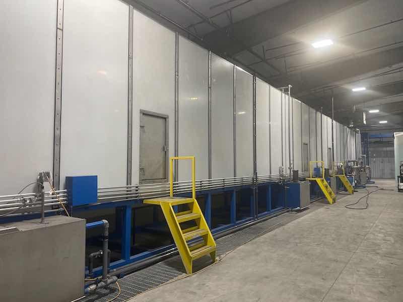 Parts head to the 90-foot-long one-turn oven where they come out, taken down off the line, and packaged.