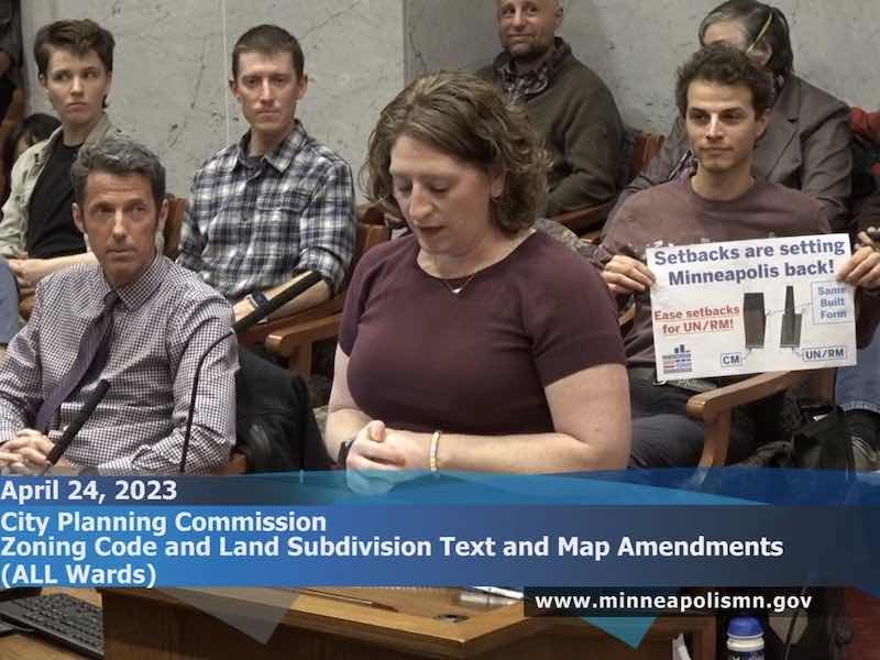 people speaking at meeting