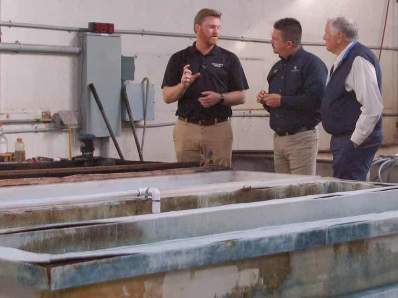 Shelby Wolters, left, speaks with officials after receiving the Most Valuable Pollution Prevention (MVP2) awards presented by the National Pollution Prevention Roundtable (NPPR).