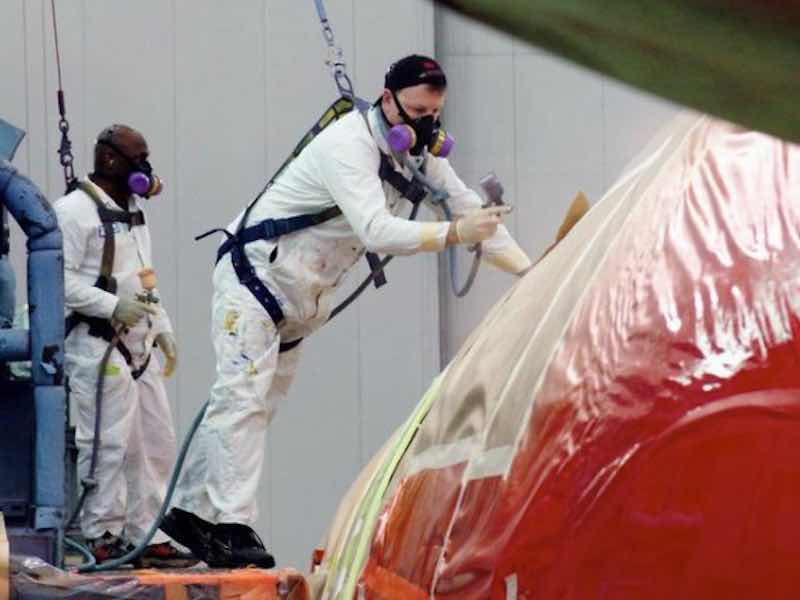 man painting a jet