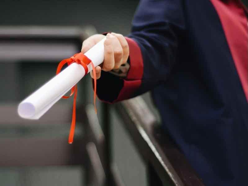 person handing out a scholarship