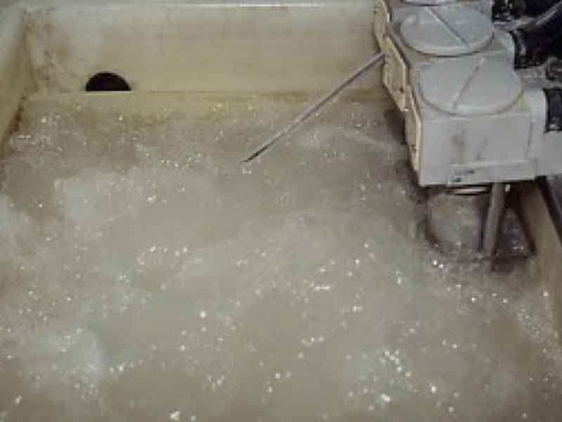 parts cleaning in an anodizing bath