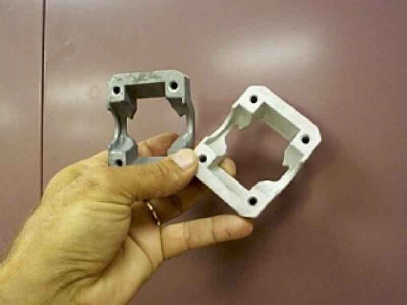 man holding two parts
